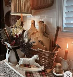 a kitchen counter topped with lots of cooking utensils