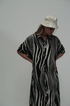 Zebra printed fabric Standard collar Button down Shirt dress Midi length Relaxed fit Imported 100% POLYESTER Model is 5 ft 10 in. Wearing a Small Caring for your clothes is caring for the environmentWash your clothes with lower temperature and delicate spin cycles. It helps to maintain the color, shape and structure of the fabric. At the same time it reduces energy consumption that is used in care processes. ONE SIZE ME3037_BLACK_ALL Black Short Sleeve Shirt Dress For Vacation, Black Relaxed Fit Shirt Dress With Short Sleeves, Black Relaxed Fit Button-up Shirt Dress, Black Collared Shirt Dress For Beach, Black Collared Shirt Dress For The Beach, Black Relaxed Fit Collared Dress, Fitted Black Shirt Dress For The Beach, Black Collared Dress With Relaxed Fit, Black Button-up Shirt Dress For Beach