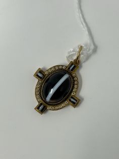 This elegant pendant is a stunning example of Victorian jewelry. The banded agate and enamel design is accented with 14k gold, making it a beautiful addition to any collection. Its unique style and material make it a rare find for any jewelry enthusiast. The pendant is perfect for anyone who appreciates the beauty of vintage jewelry and wants to add a touch of history to their collection. Art Deco Hallmarked Enamel Jewelry, Formal Enamel Oval Pendant Jewelry, Luxury Enamel Oval Pendant Jewelry, Luxury Oval Pendant Enamel Jewelry, Antique Oval Agate Jewelry, Luxury Enamel Locket Jewelry, Art Deco Enamel Round Jewelry, Art Deco Round Enamel Jewelry, Elegant Enamel Jewelry With Large Pendant