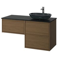 a bathroom sink sitting on top of a wooden cabinet next to a faucet