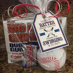 a gift bag filled with baseballs and candy