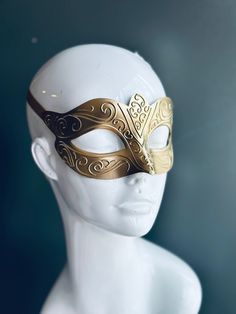 Crafted with meticulous artistry, this golden mask captures the essence of Venetian glamour, perfect for masquerade balls, themed galas, or any occasion where you want to make a dramatic entrance.


Age Group/Gender - Adult/Women

Size/Type - One size fits all adults

Mask Color - Gold

Mask Material - Polyresin

Accent Material - Paint Luxury Gold Mask For Masquerade, Golden Mask, Gold Masquerade Mask, Gold Face Mask, Dramatic Entrance, Gold Mask, Venetian Masks, Rich Family, Venetian Mask