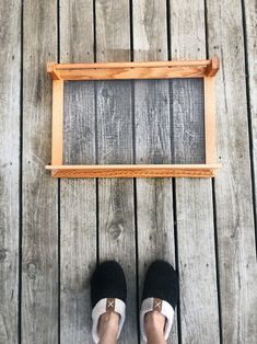 a person standing on top of a wooden floor