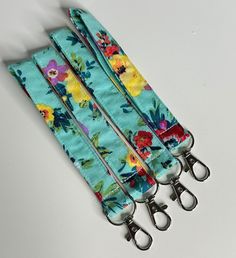 Blue Floral Handmade Keychain Wristlet. Made to order. Used for keychains, air pod holder, other accessories, etc. Adjustable Wristlet With Interior Key Chain Holder For Travel, Blue Lanyard With Key Leash For Personal Use, Blue Lanyard With Key Leash For Gift, Blue Lanyard With Key Leash As Gift, Blue Lanyards With Key Leash As Gift, Multicolor Wristlet With Key Leash For Everyday, Blue Keychains With Key Leash For Everyday Use, Blue Keychain With Key Leash For Everyday Use, Multicolor Everyday Wristlet With Key Leash