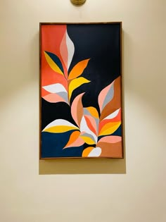 a painting hanging on the wall next to a clock