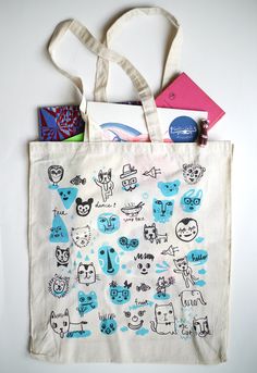 a tote bag with various items on it