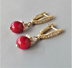 There lovely red coral earrings gold with CZ will be a perfect wedding anniversary gift, unique birthday gift, Mothers day gift or graduation gifts for her women wife girl, grandma niece mom, sister daughter aunt or best friend gift. Handmade jewelry gift is always especial gift. Coral drop earrings length: 1 1/4 inc / 3,3 cm. 24K gold plated finish with CZ CORAL: ♥ Absorbs negative energy ♥ Platonic love ♥ Friendship ♥ Community ♥ Creativity ♥ Passion ♥ Romantic love ♥ Wisdom ♥ Optimism ♥ Enthu Elegant Red Drop Earrings, Elegant Coral Earrings For Formal Occasion, Elegant Handmade Red Earrings, Elegant Coral Jewelry For Anniversary, Coral Earrings For Gift, Coral Elegant Jewelry With Matching Earrings, Elegant Coral Jewelry For Gift, Red Dainty Earrings For Anniversary, Red Earrings With Lever Back For Gift