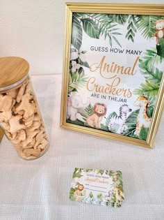 an animal crackers are in a jar next to a sign