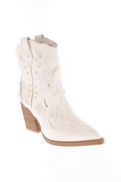 a white cowboy boot with wooden heel and studded details on the side, front view