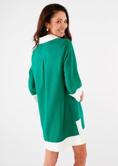 Want to feel easy, breezy, and chic this Summer? This high-style mini caftan in a popping kelly green is just the thing to help you channel your inner 60's movie star. The drapey, lightweight linen fabric will keep you cool while the covered buttons, color-blocked trim, and collar will deliver style that can take you beyond poolside hangouts. Sizing: Generous fit - We recommend that if you are between sizes to size downMake: Collared with covered buttons and contrast trim. In-seam pockets. Measu