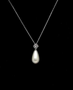 light cream teardrop high quality shell pearl drop pendant with round rhodium silver cubic bail decorated. This listing is for necklace only... Size of pendant including bail : 2.7cm x 1.1cm Matching earrings available. Please inquire. Set/bulk discounts available. Please inquire. :) Classic Sterling Silver Drop Necklace For Wedding, Classic Diamond White Drop Necklace For Wedding, Classic Wedding Pendant Drop Necklace, Classic Teardrop Pendant Bridal Necklace, Wedding Pearl Pendant Drop Necklace, Elegant Pearl Teardrop Pendant Necklace, Formal Bridal Pearl Drop Pendant Necklace, Formal Bridal Pendant Necklace With Pearl Drop, White Gold Teardrop Pearl Necklace