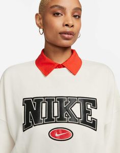 Sweatshirt by Nike Exclusive to ASOS Crew neck Long sleeves Branded design Relaxed fit White Varsity Top With Ribbed Cuffs, White Crew Neck Top With Ribbed Collar, White Ribbed Collar Tops For Streetwear, White Tops With Ribbed Collar For Streetwear, White Crew Sweatshirt With Ribbed Collar, White Crew Neck Sweatshirt With Ribbed Collar, Nike Long Sleeve Sweatshirt For College, Nike Relaxed Fit Graphic Sweatshirt, Nike Collegiate Tops For Fall