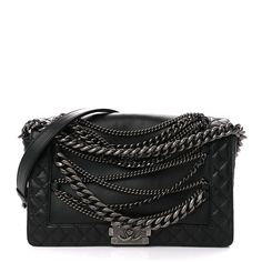 This is an authentic CHANEL Calfskin Enchained Medium Boy Flap in Black. This chic shoulder bag is crafted of smooth calfskin leather in black with diamond-quilted framed flap edges. The unique features of this boldly crafted bag are the several styles of draped ruthenium chains across the front. These complement the long chain and leather shoulder strap that can be worn crossbody. The flap opens with a ruthenium boy CC push lock to a fabric interior with zipper and patch pockets. This is an exc Luxury Goth, Chanel Bag Boy, Boy Chanel Bag, Chanel Boy Bag Black, Chanel Cuff, Chanel Purse Black, Chanel So Black Flap Bag, Crafted Bag, Stylish Shoulder Bag