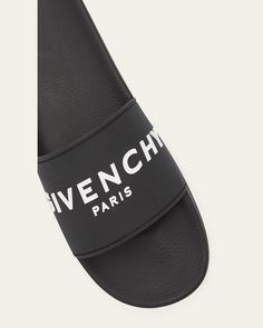 Givenchy slide sandals in rubber    Flat heel    Open toe    Single band vamp    Raised logo lettering    Molded footbed    Easy slide style    Made in Italy Luxury Summer Slides With Rubber Sole, Designer Slides For Summer, Luxury Beach Slides With Rubber Sole, Classic Slides With Rubber Sole, Designer Open Toe Slides With Rubber Sole, Designer Cushioned Slides Slip-on, Luxury Summer Sandals With Logo, Luxury Slides With Cushioned Footbed, Designer Cushioned Slip-on Slides