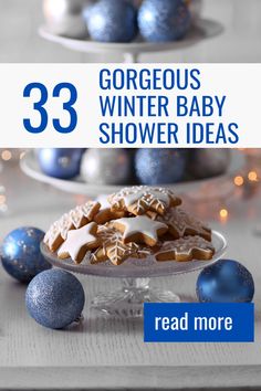 three plates with cookies and blue balls on them, the text reads 33 gorgeous winter baby shower ideas read more