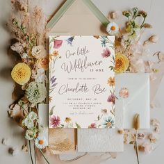 wedding stationery with flowers and greenery