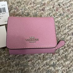 Coach Mini Wallet Never Used Tags In Pics Pink Compact Coach Trifold Wallet With Card Slots, Compact Bag With Interior Key Chain Holder, Compact Coach Wallet With Interior Card Slots, Compact Coach Wallet, Compact Travel Wallet By Coach, Compact Coach Wallet For Travel, Pink Rfid Blocking Bags, Compact Coach Wallet As Gift, Pink Compact Leather Wallet