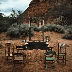 several chairs are set up in the desert