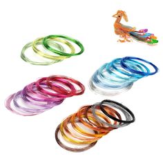 four different colored rubber bands are arranged in the shape of a rooster and a bird