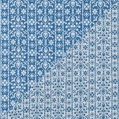 a blue and white rug with an intricate design