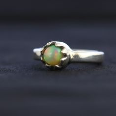 Silver Ethiopian Opal Ring With Cabochon, Unique Opal Ring With Birthstone, Unique Ethiopian Opal Cabochon Rings, Iridescent Opal Ring In Sterling Silver For Anniversary, Green Opal Cabochon Ring, Unique Green Opal Ring, Iridescent Opal Cabochon Ring For Anniversary, Green Opal Ring As A Gift, Green Opal Ring Gift