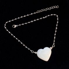 All genuine gemstone with this more rare heart called a Scolecite. With natural very light blue topaz and wrapped fresh water pearls. 16.5" long 2" silver chain, 18.5" total length A definite piece to cherish forever. One of my one of a kinds. Very special. Makes a great gift. White Heart-shaped Necklace With Pearl Chain, White Heart Shaped Pearl Chain Necklace, White Heart-shaped Pearl Chain Necklace, Delicate White Heart Beads Necklace, White Heart Necklace With Pearl Pendant, Delicate White Heart Necklace With Heart Beads, White Heart Pendant Necklace In Spiritual Style, White Heart Pendant Necklace With Spiritual Style, White Necklace With Silver Chain As Gift