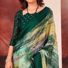 Green colored saree is made from chiffon fabric which is highlighted with beautiful printed work as shown. Comes along with unstitched chiffon blouse piece which you can customise as per your design/style. Occasion - You can wear this saree for casual, and homely events. Note:- the actual product may differ slightly in color and design from the one illustrated in the images when compared with computer or mobile screen. Measurements: Saree : Chiffon : 5.5 Mtrs Blouse : Chiffon : 0.8 Mtr Material: Chiffon Stitch Type: Unstitched Country of Origin: India Care Guide: Dry Clean Elegant Georgette Blouse Piece With Digital Print, Art Silk Blouse Piece With Digital Print, Festive Pre-draped Georgette Saree With Digital Print, Unstitched Green Saree Blouse, Green Georgette Blouse Piece With Pallu, Green Semi-stitched Dupatta With Digital Print, Georgette Blouse With Printed Motifs For Festivals, Georgette Digital Print For Festivals, Green Georgette Blouse Piece