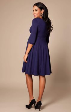 Cut to flatter throughout your pregnancy and after baby arrives too, the gently tailored shape of our Sienna Maternity Dress drapes beautifully over your curves with a soft panelled Ponte Roma skirt and neat princess seams to the bust. A classy and chic look that’ll never go out of style, this smart maternity dress in stylish navy blue is the perfect desk to dinner dress for your maternity wardrobe. Premium Ponte Roma fabric Classic fit and flare shape Soft paneled skirt for structure and a flat Elegant Nursing Friendly V-neck Dress, Elegant Fitted V-neck Maternity Dress, Elegant Fit And Flare Dress With Empire Waist, Solid Dress With Fitted Bodice And Flattering Silhouette, Elegant Midi Dress With Empire Waist, Fitted Maternity Midi Dress, Modest Fitted Empire Waist Dress, Elegant Evening Dress With Princess Seams, Elegant Empire Waist Midi Dress