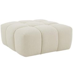 a white ottoman with four square sections on the top and bottom, in front of a white background