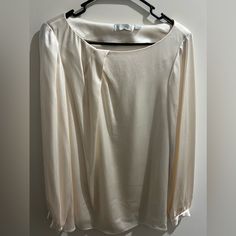 Chic Ivory Colored Satin Blouse With Long Sleeve And Silver Buttons. Brand New. Elegant Cream Long Sleeve Tops, Elegant Cream Office Tops, Elegant Long Sleeve Cream Tops, Classic White Tops For Party, Classic White Party Tops, Classic White Party Top, Chic Cream Formal Top, Spring Cream Blouse For Formal Occasions, Spring Formal Cream Blouse