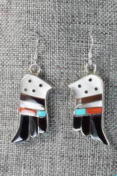 This turquoise, onyx, mother of pearl, coral and sterling silver inlay set was made by Zuni silversmith Bobby Shack. The set is signed B&C Shack, Zuni and Sterling.Necklace: 15"Pendant Length: 2 3/8"Pendant Width: 2 1/4"Earrings:Length: 1 7/8"Width: 3/4"Bracelet:Size: 5" (will fit up to a 6 3/8" wrist)Gap: 1 3/8"Width: 1 5/8"Free shipping on all orders! We ship with USPS and always include tracking. All orders ship within a day of payment.Returns are accepted up to 30 days after you receive your Black Inlay Jewelry As A Gift, Black Jewelry With Inlay For Gift, Black Sterling Silver Jewelry With Inlay, White Sterling Silver Jewelry With Inlay, Sterling Silver Jewelry With White Inlay, Southwestern Black Sterling Silver Jewelry, Unique White Jewelry With Inlay, White Jewelry With Inlay, Traditional White Jewelry With Inlay