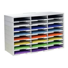 a large white storage unit with many different colored file folders on the bottom shelf