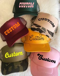 Choose from our wide range of unique fonts and color combinations to create your own customized trucker hat! Each trucker hat is high crown, foam with terry lining inside, with a snap back adjustment.  Please select your hat color and text color. Add your number of font selection and personalized text on personalization option. After purchase is complete, we will follow up with a message to you within 48 hours with a mock-up for you to approve before we make it! Salon Merch, Back Adjustment, Hat Bar, Custom Trucker Hats, Unique Fonts, Snap Back, Snap Backs, Custom Hats, Text Color