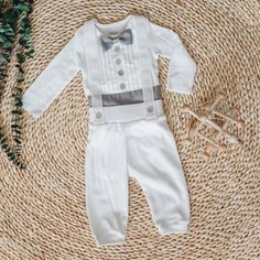 A Gray update to the all white tuxedo, this beautiful, custom made outfit is suitable for weddings, seasonal parties or any special event. Made using Carter's white bodysuits with tuxedo shirt details added and suspenders. Pants are handmade with super soft cotton knit material.  The standard bow tie is made from grosgrain ribbon that provides a textured/ribbed look.  If you prefer satin please let me know.  The color motif includes the bow tie, buttons and cummerbund.  Suspenders are white.  If White Fitted Sets With Bow Tie, White Adjustable Tie With Satin Bow, Classic White Adjustable Bow Tie, Tuxedo Outfit, White Satin Bow Tie Adjustable, Suspenders Pants, Boys Tuxedo, Oxford Shoes Style, Tuxedo Shirt