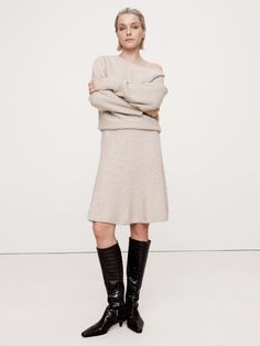 This sweater dress beautifully demonstrates the power of texture, using a mix of diagonal and vertical ribbed knit stitches to emphasize the luxurious handfeel of its wool-blend fabric.  Here, we knitted this mini dress using one of our warmest wool-blend yarns, one we selected for its softness and subtle, bouclé texture.  Relaxed fit with defined waist, flare skirt.  Boat neck.  Pull-on design.  Unlined.  Relaxed fit with defined waist, flare skirt.  Long sleeves.  Mini length.  Model: Size S, 5'10" (178cm). Extra Dresses, Mini Sweater, Defined Waist, Knit Stitches, Comfy Dresses, Skirt Long, Outfit Inspiration Fall, Mini Sweater Dress, Winter Wear