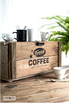 a wooden crate with coffee cups on it