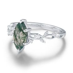 Wrap your fingers in the never-ending love that you deserve with our Everlasting Marquise Moss Agate Ring. This marquise-shaped moss agate ring is adorned with white topaz that gleams through a twisted leafy band. Evoking a natural elegance, a timeless charm doesn't get much sweeter than this. ✦ Available in 10K/14K Solid White, Yellow, and Rose Gold Elegant Moss Agate Rings With Natural Inclusions, Moss Agate Gemstone Rings For Wedding, Moss Agate Gemstone Rings For Anniversary, Anniversary Moss Agate Gemstone Rings, Nature-inspired Wedding Rings With Natural Stones, Moss Agate Wedding Ring Jewelry, Agate Wedding Rings With Natural Stones, Wedding Moss Agate Ring Jewelry, Fine Jewelry Promise Ring With Natural Inclusions