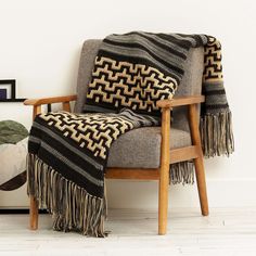 a chair with a blanket on top of it