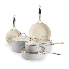 an assortment of pots and pans on a white background