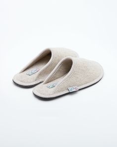 Description: The Le Clare women's Stella in beige is the classic "hotel slipper" reimagined in luxurious boiled wool. This quintessential slipper provides delicate comfort and has been handcrafted, only for the most discerning, the Stella will not disappoint. Featuring our premium Italian boiled wool fiber, the slipper gently conforms to your foot for cozy comfort. The natural elasticity of our wool bounces back to its original shape, giving the slipper lasting appeal with a customized fit. This Hotel Slippers Luxury, Classic Closed Toe Winter Slippers, Soft Beige Slip-on Slippers, Comfortable Soft Beige Slippers, Beige Soft Comfortable Slippers, Beige Soft Slippers, Cream Round Toe Indoor Slippers, Cream Slip-on Slippers With Cushioned Footbed, Beige Closed Toe Indoor Slippers