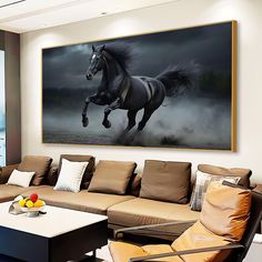 a living room with couches and a large horse painting on the wall above it