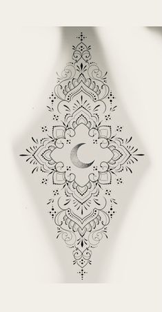 an intricate design with a crescent in the middle