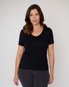 Introducing The Semi-Fitted Undershirt. We know a snug and slim fit isn't for everyone, so we created a new version of our undershirt designed with added ease through the body and a raised neckline. This style is perfect for anyone looking for a more modest look and coverage. This undershirt is made with the same best-selling sweat proof technology, designed with built-in underarm shields that wick away moisture and odor. Stretch Tops With Built-in Bra For Layering, Stretch Crew Neck Top With Built-in Bra, Basic High Stretch Top With Built-in Bra, V-neck Top With Built-in Bra For Everyday, Everyday V-neck Top With Built-in Bra, Basic Fitted Tops With Built-in Bra, Stretch Tops With Built-in Bra For Everyday, Everyday Stretch Tops With Built-in Bra, Seamless Snug Fit Short Sleeve Top