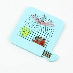 an electronic device with colorful designs on the front and back cover, sitting on a white surface