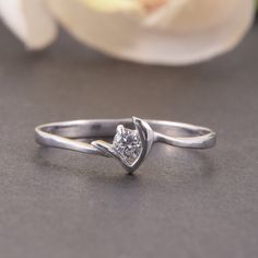 "Solitaire promise ring, Tiny ring, Dainty ring, Elegant ring, Silver ring for her, Promise ring for her, Geometric ring, Unique silver ring WE OFFER UNLIMITED PERIOD INSTALLMENTS PLAN This is a beautiful, stunning, feminine ring that works well for all occasions, styles, and ages. You will love it! Ring information Main stone: White cubic zirconia Approximate size: 3.0mm Metal type: Silver Metal stamp: 925 Sterling SIlver Customization / Replacements It's easy to create jewelry that's perfect f Silver Jewelry With Single Diamond For Proposal, Silver Diamond Jewelry For Proposal, Silver Stackable Promise Rings With Single Diamond, Silver Stackable Rings With Single Diamond For Promise, Silver Dainty Diamond Ring For Proposal, Silver Rings With Single Diamond As Gift, Silver Ring With Single Diamond As Gift, Silver Ring With Single Diamond For Gift, Silver Bypass Ring With Tension Setting For Wedding