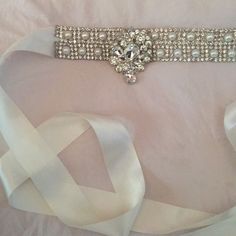 Satin Bridal Sash Pearls & Rhinestones W Pendant Missing One Rhinestone Elegant White Sashes With Rhinestones, Elegant Embellished White Bridal Belt, White Crystal Bridal Belt For Party, White Crystal Sash For Formal Occasions, White Crystal Sashes For Formal Occasions, Formal White Crystal Sash, White Rhinestone Bridal Belt For Evening, Bedazzled White Bridal Belt For Wedding, Evening White Bridal Belt With Rhinestones