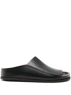 black calf leather smooth grain round open toe slip-on style branded moulded footbed flat rubber sole Modern Slip-on Slides With Leather Sole, Slip-on Open Toe Sandals With Stitched Sole, Black Open Toe Slip-ons, Modern Slip-on Slides With Textured Sole, Calf Leather Mules With Single Toe Strap, Classic Flat Sandals With Rubber Sole, Black Slide Sandals For Formal Wear, Black Slide Sandals For Formal Occasions, Spring Leather Slides With Stitched Sole