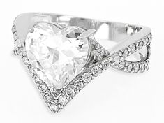 Bella Luce® white diamond simulant 6.23ctw round and heart rhodium over sterling silver heart ring. Measures approximately 0.88"L x 0.56"W and is not sizable. The diamond equivalent weight is 3.77ctw. White Diamond-cut Heart Ring, White Heart Cut Diamond Heart Ring, White Heart Cut Brilliant Ring, White Brilliant Cut Heart Ring For Valentine's Day, White Heart Cut Diamond Ring For Valentine's Day, White Heart-shaped Diamond Ring With Vs Clarity, White Diamond Heart Ring With Vs Clarity, White Heart Diamond Ring Vs Clarity, Heart Shaped White Diamond Ring With Vs Clarity