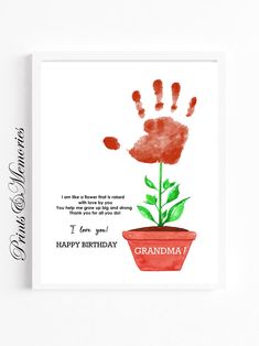 a card with a handprint of a flower in a pot and the words grandma on it