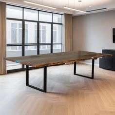 a large wooden table in an empty room